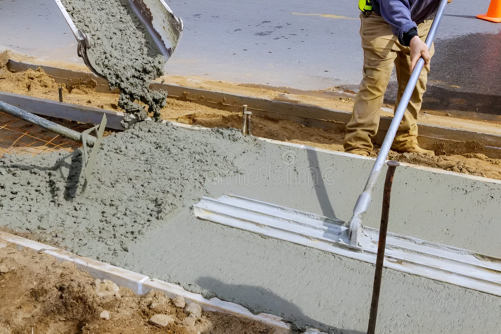 construction-worker-pour-cement-sidewalk-concrete-works-mixer-truck-wheelbarrow-construction-worker-pour-cement-174934263